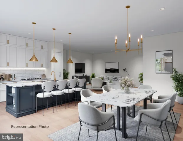 a view of a kitchen with furniture window and wooden floor