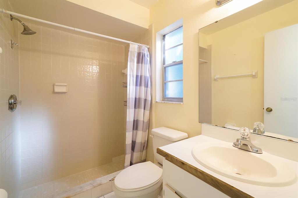 6260 Morning Mist Lane Orlando, FL 32819 - Photo 16 of 27 a bathroom with a sink toilet and shower