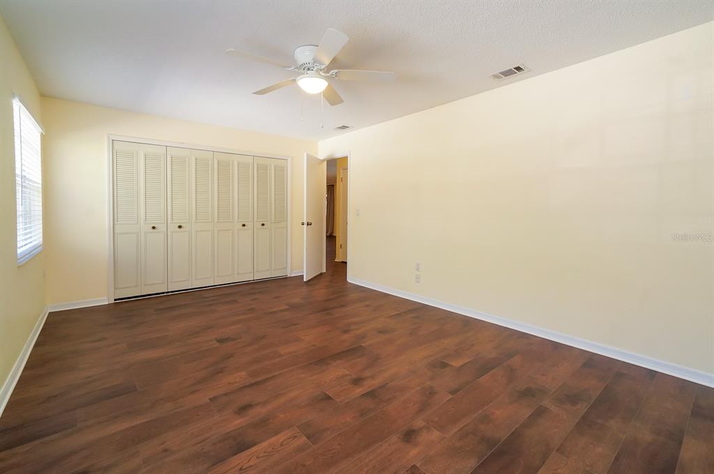 6260 Morning Mist Lane Orlando, FL 32819 - Photo 20 of 27 wooden floor in an empty room