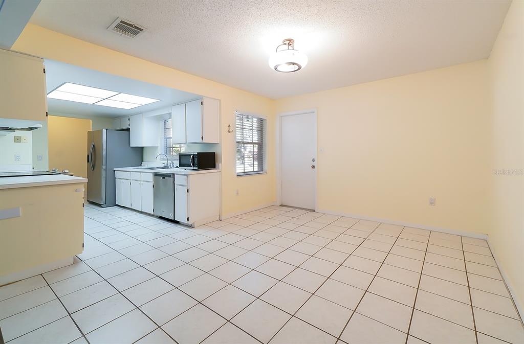 6260 Morning Mist Lane Orlando, FL 32819 - Photo 6 of 27 a view of a kitchen with electric appliances