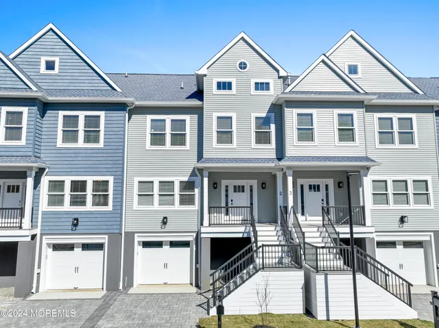 a view of multiple houses with a yard
