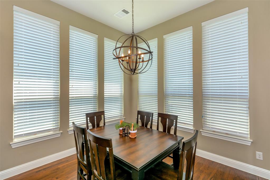 1001 West Bluff Way Roanoke, TX 76262 - Photo 13 of 40 Dining room featuring dark wood-style flooring and a chandelier