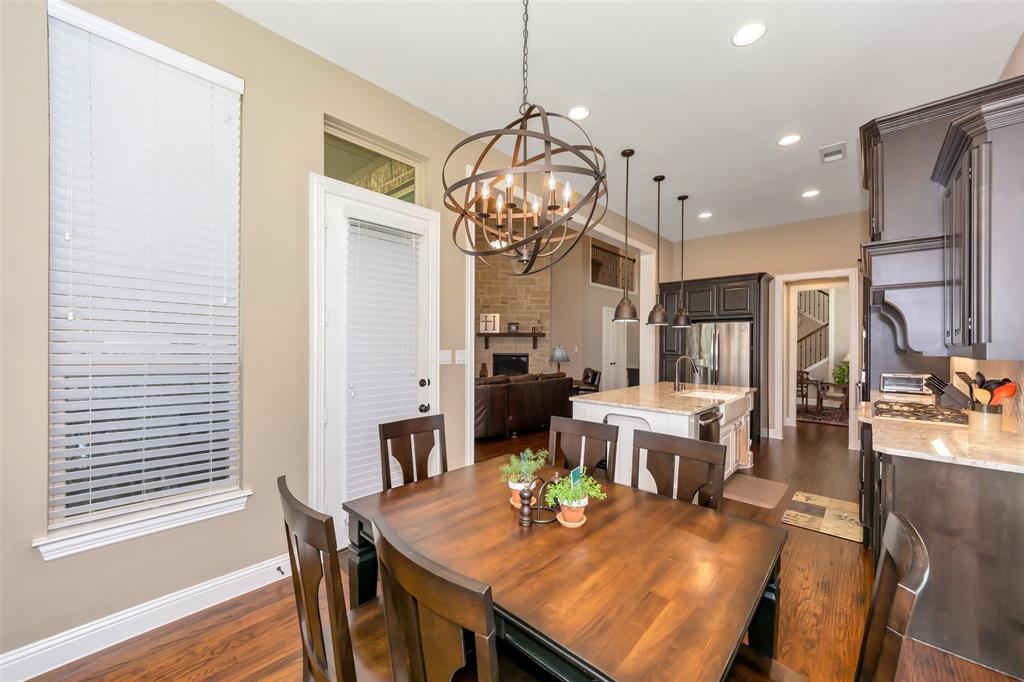 1001 West Bluff Way Roanoke, TX 76262 - Photo 16 of 40 Dining space with dark wood-style flooring, recessed lighting, and a chandelier