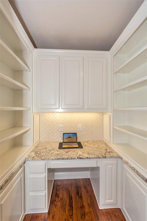 1001 West Bluff Way Roanoke, TX 76262 - Photo 19 of 40 Unfurnished office with built in desk and dark wood-style flooring