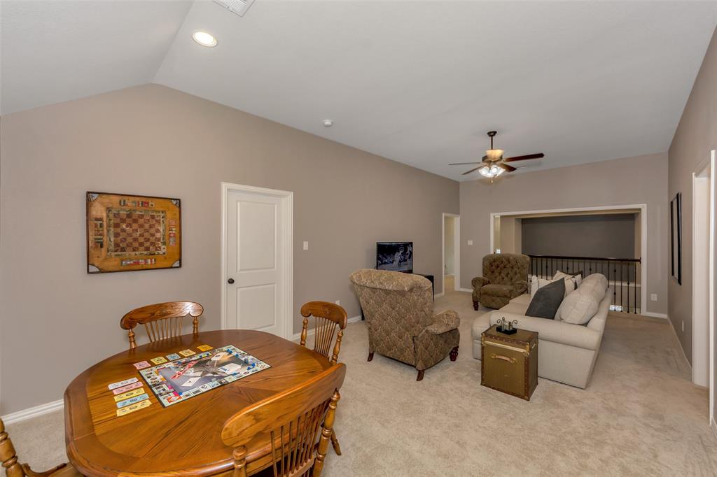 1001 West Bluff Way Roanoke, TX 76262 - Photo 26 of 40 Dining area with carpet floors and lofted ceiling