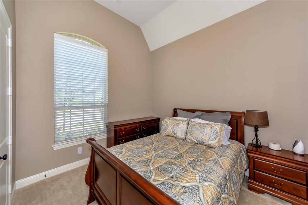 1001 West Bluff Way Roanoke, TX 76262 - Photo 5 of 40 Bedroom featuring light colored carpet (carpet has been replaced with hardwood) and lofted ceiling