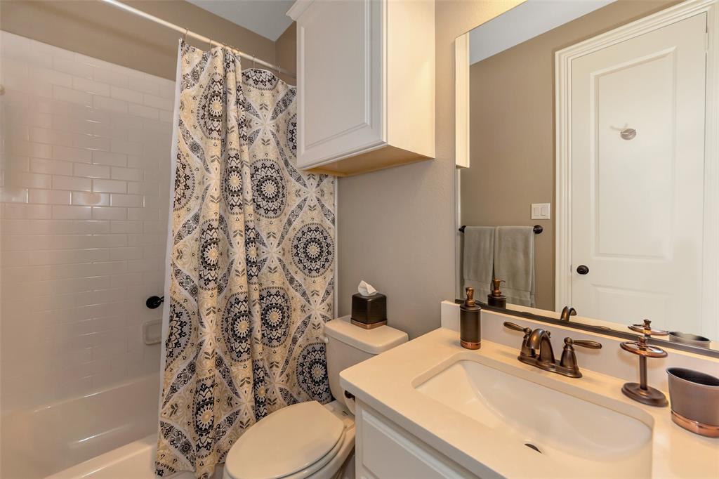 1001 West Bluff Way Roanoke, TX 76262 - Photo 6 of 40 Bathroom with vanity and shower / bath combo with shower curtain
