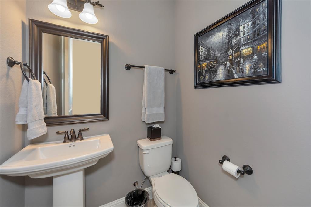 1001 West Bluff Way Roanoke, TX 76262 - Photo 8 of 40 Half bath with toilet and baseboards