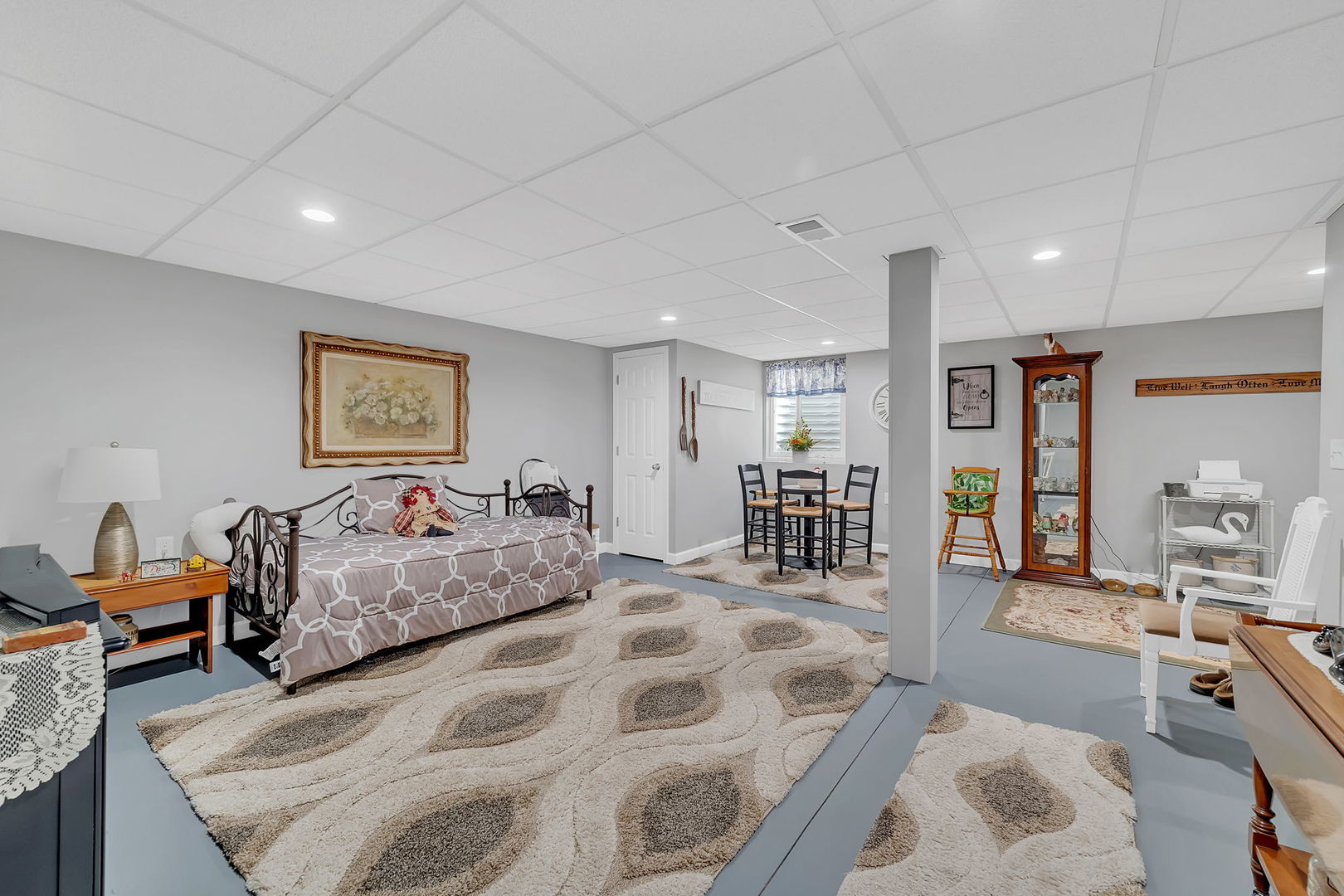 1761 Red Willow Road Morris, IL 60450 - Photo 25 of 38 a spacious bedroom with a bed a couch and a bookshelf with the wooden floor