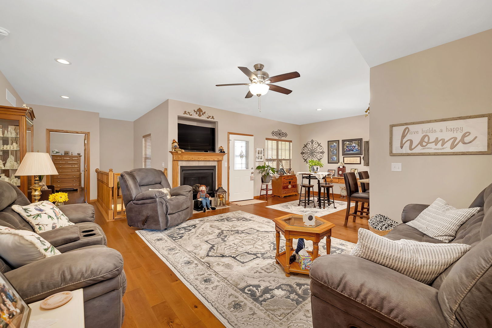 1761 Red Willow Road Morris, IL 60450 - Photo 5 of 38 a living room with furniture a fireplace and a flat screen tv
