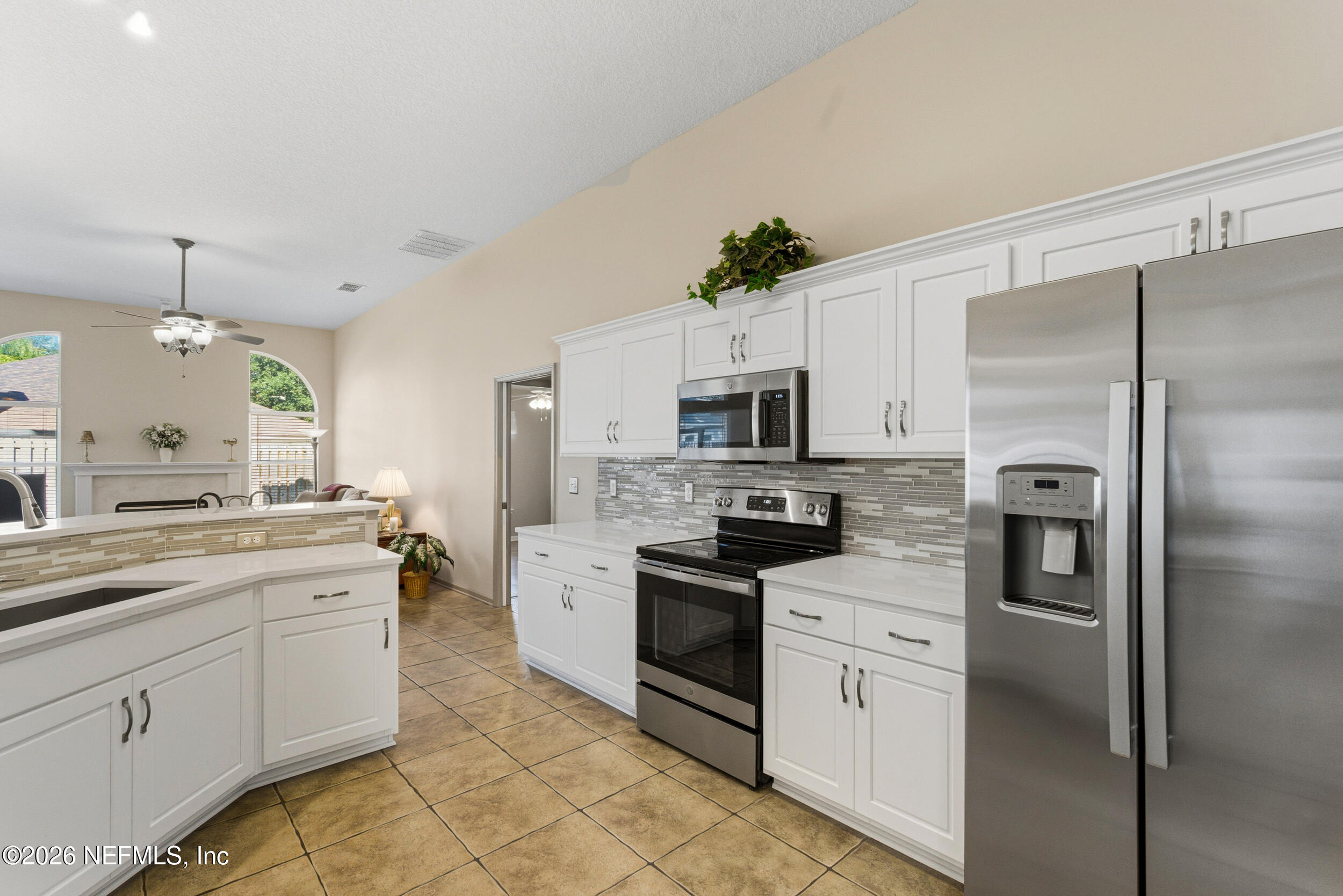4309 Rye Court St. Johns, FL 32259 - Photo 11 of 55 a kitchen with stainless steel appliances a refrigerator sink and stove