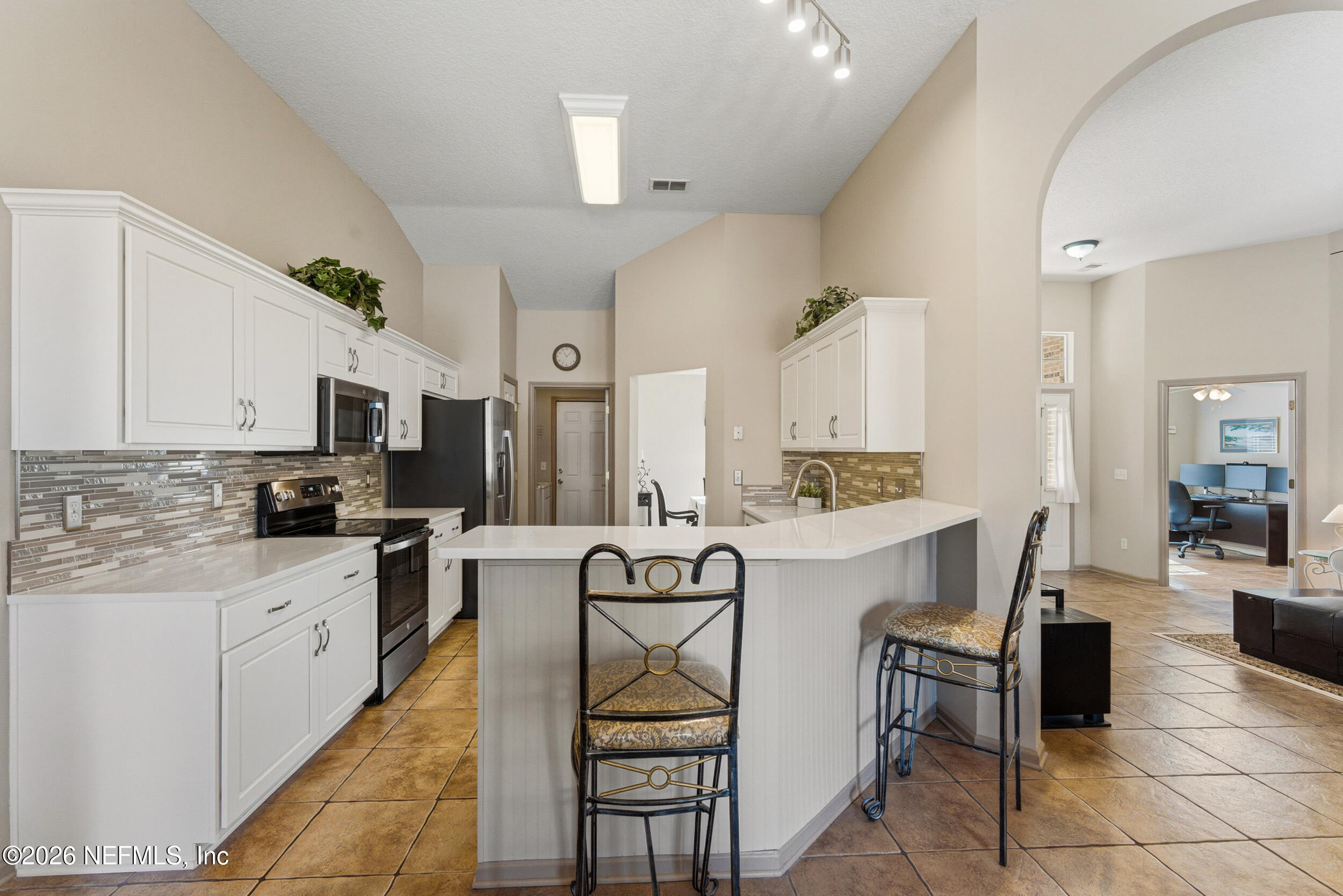 4309 Rye Court St. Johns, FL 32259 - Photo 13 of 55 a kitchen with a sink a counter top space appliances and cabinets