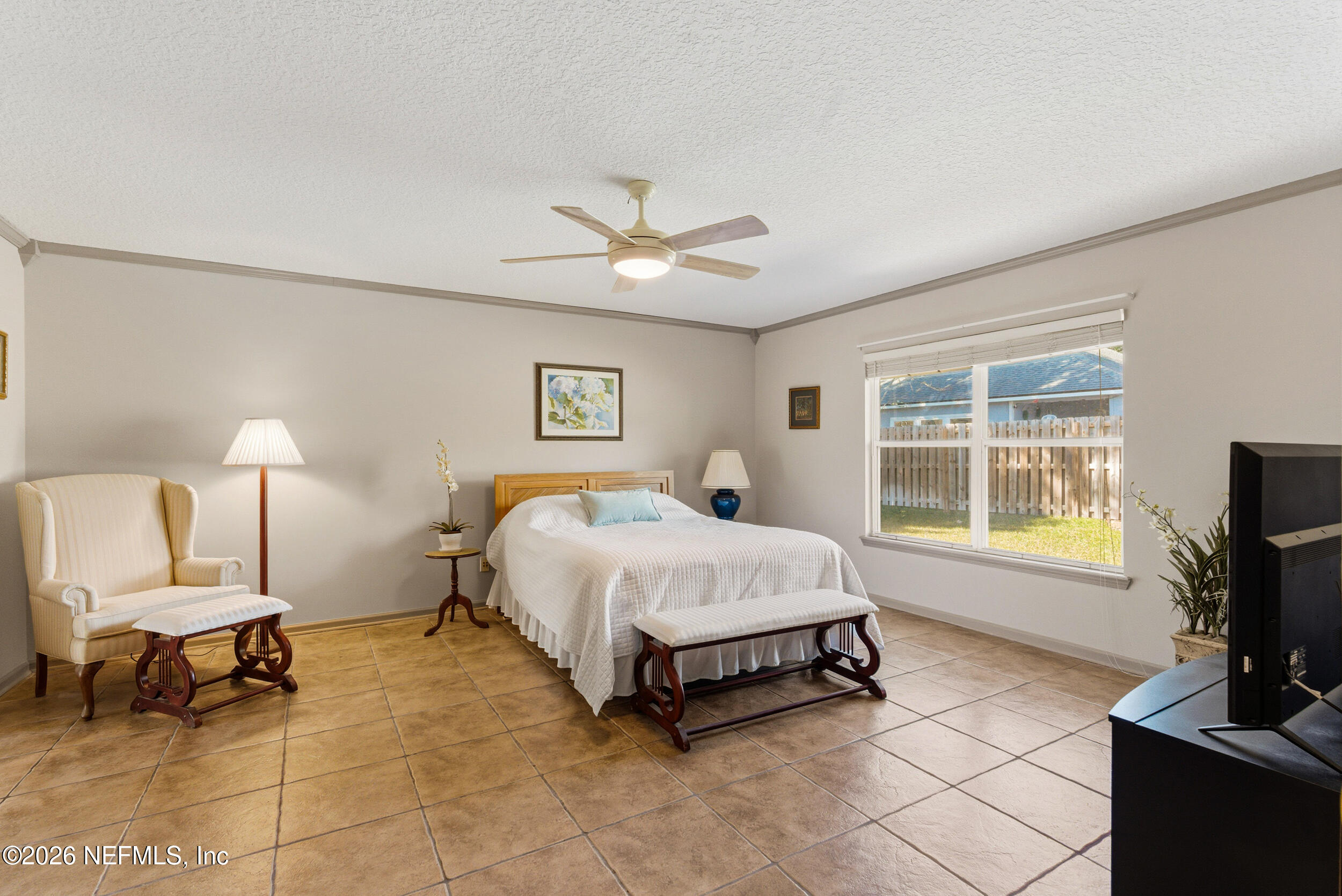 4309 Rye Court St. Johns, FL 32259 - Photo 20 of 55 a spacious bedroom with a bed and a flat screen tv