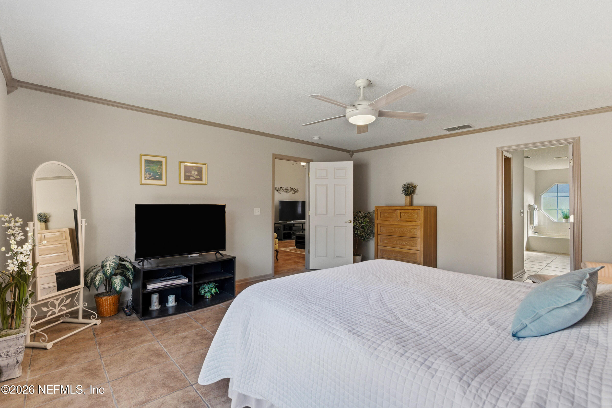 4309 Rye Court St. Johns, FL 32259 - Photo 22 of 55 a bedroom with a bed and a flat screen tv