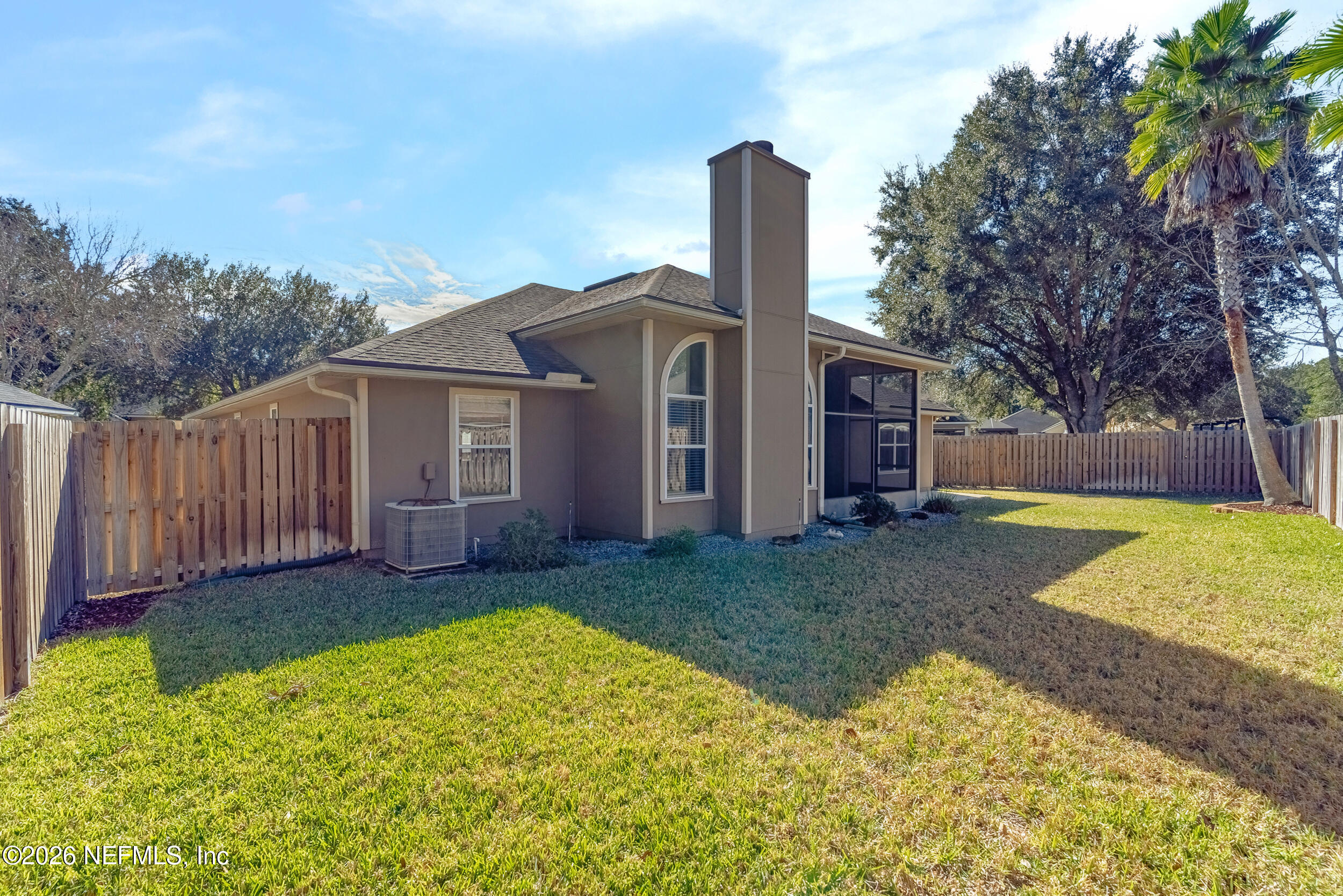 4309 Rye Court St. Johns, FL 32259 - Photo 36 of 55 a view of a house with backyard and tree