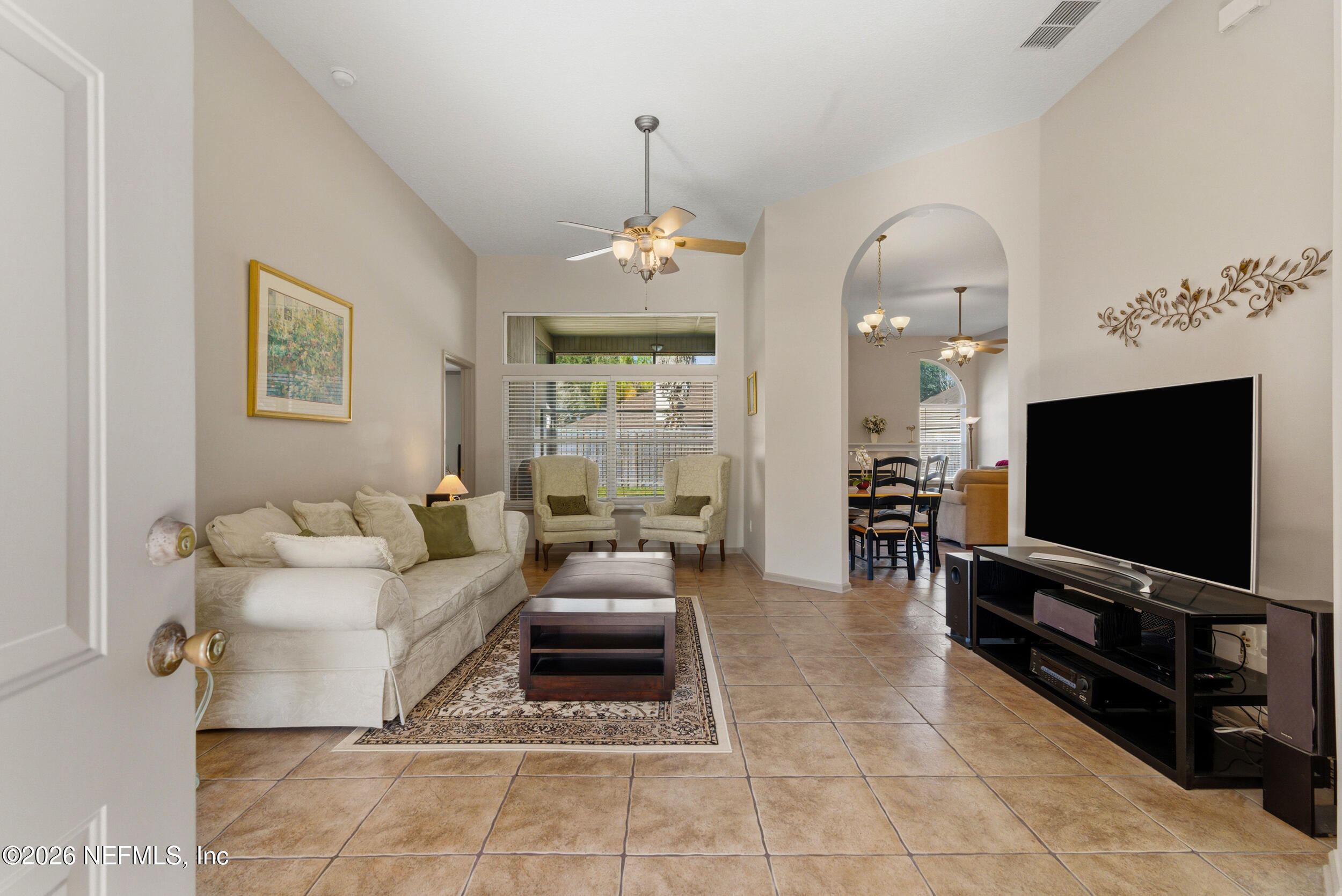 4309 Rye Court St. Johns, FL 32259 - Photo 4 of 55 a living room with furniture and a flat screen tv