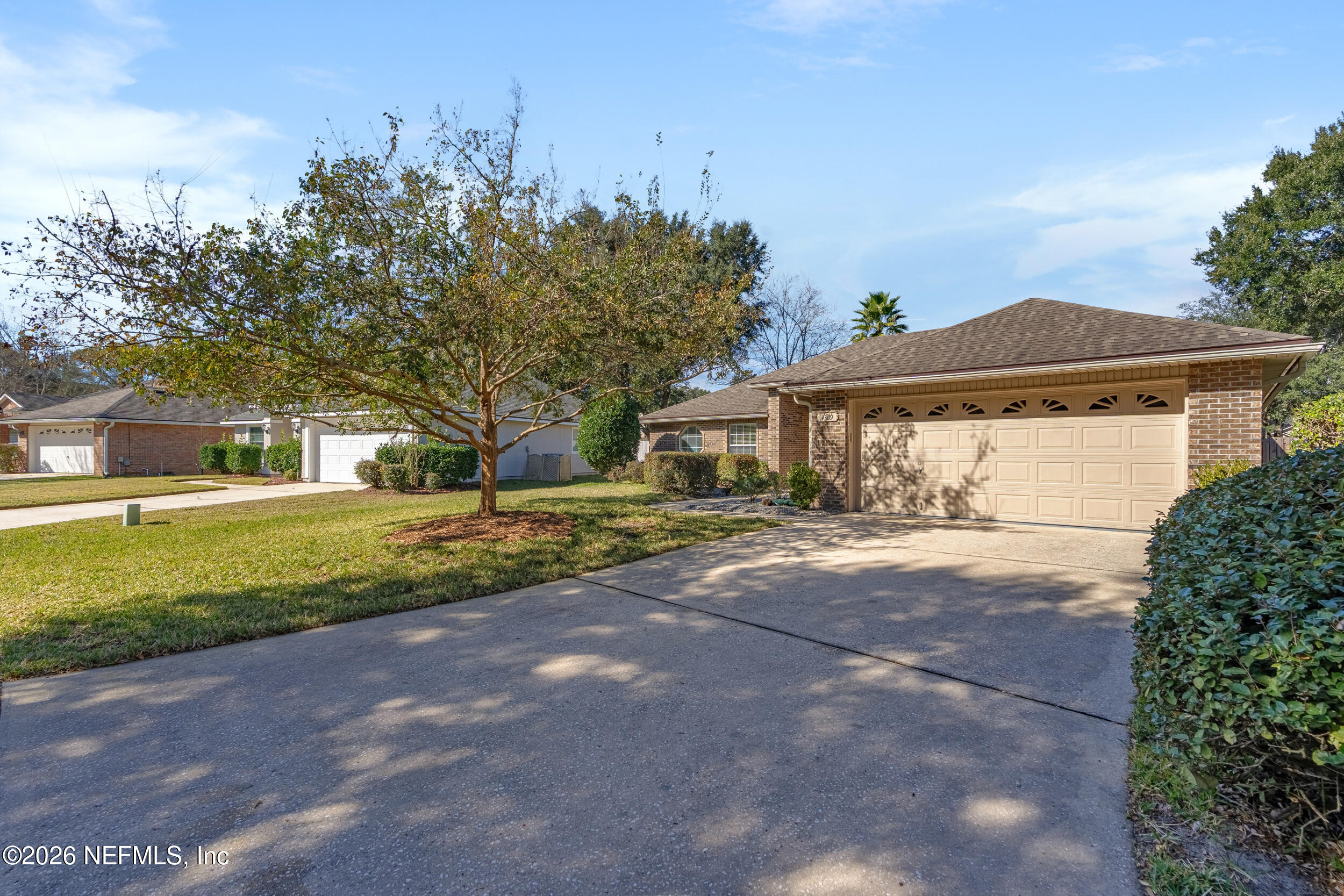 4309 Rye Court St. Johns, FL 32259 - Photo 41 of 55 a front view of a house with a yard and garage
