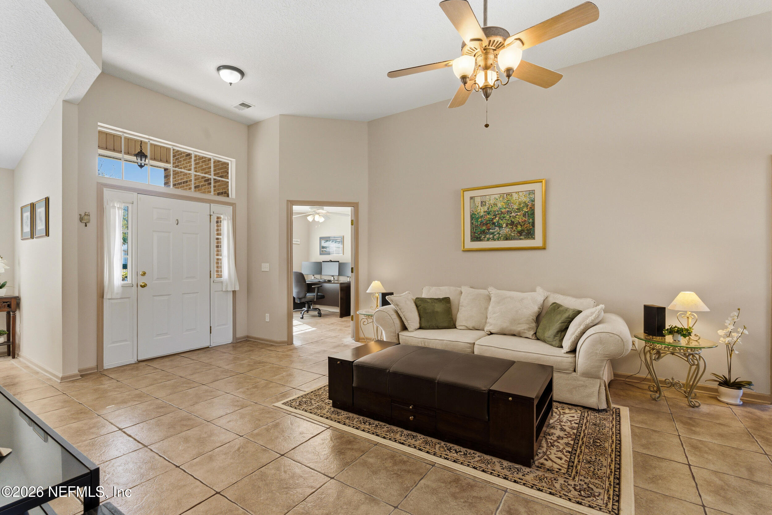 4309 Rye Court St. Johns, FL 32259 - Photo 5 of 55 a living room with furniture and a chandelier