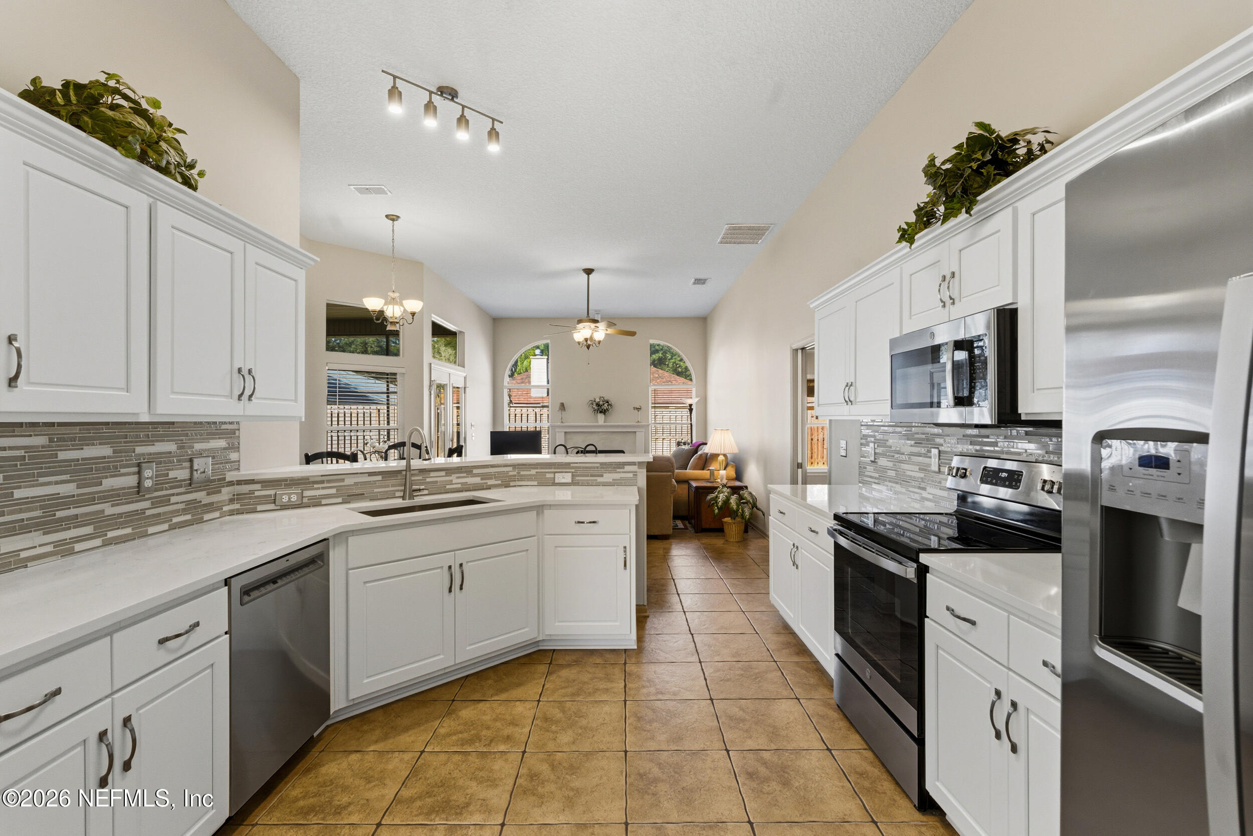 4309 Rye Court St. Johns, FL 32259 - Photo 10 of 55 a kitchen with a sink stove and refrigerator