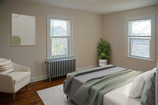95 Adams Street, Unit 9 Waltham, MA 02453 - Photo 4 of 8 a bedroom with a bed and a window