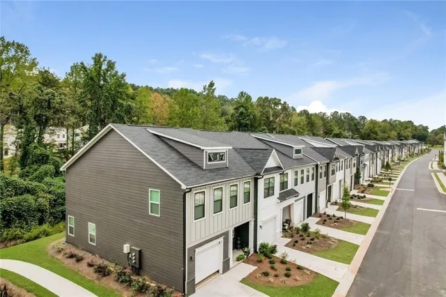 a view of a park with large trees