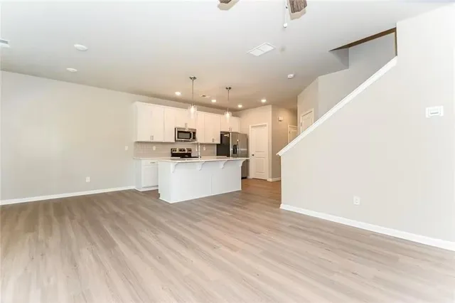 a view of kitchen with wooden floor