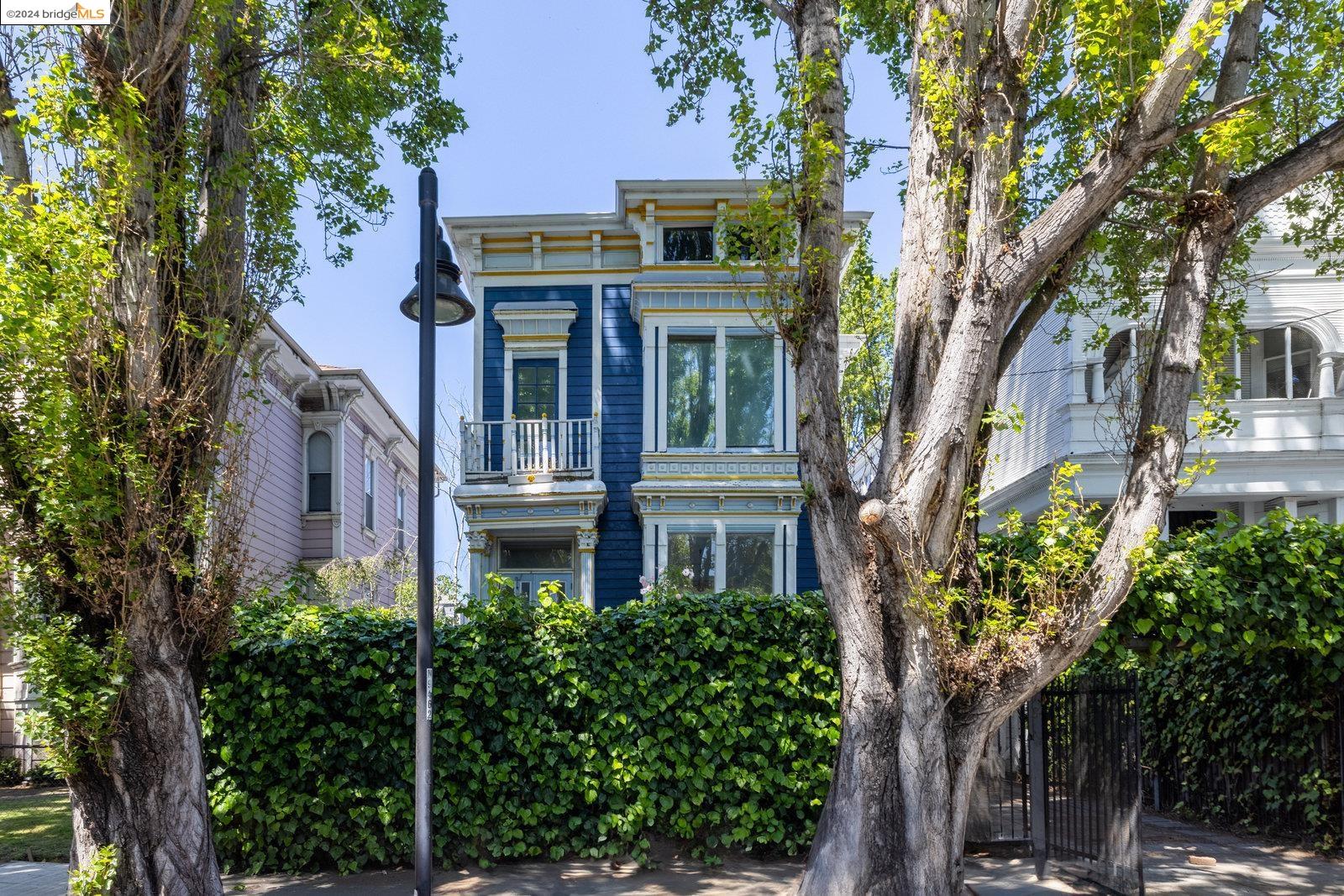 1418 8th Street Oakland, CA 94607 - Photo 1 of 1 a view of a building with a tree in front of it