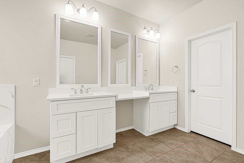 4535 Mondial Road Katy, TX 77493 - Photo 21 of 26 Primary bathroom with upgraded cabinets and countertops