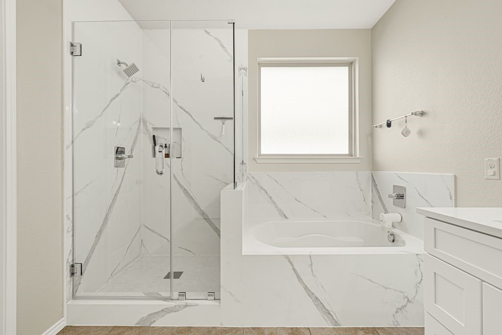 4535 Mondial Road Katy, TX 77493 - Photo 22 of 26 New porcelain for tub and shower with frameless shower.