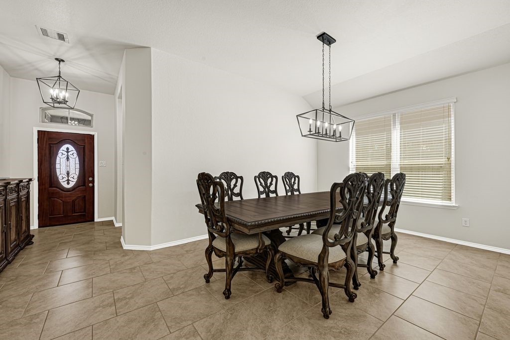 4535 Mondial Road Katy, TX 77493 - Photo 7 of 26 Formal dining and entrance of home.