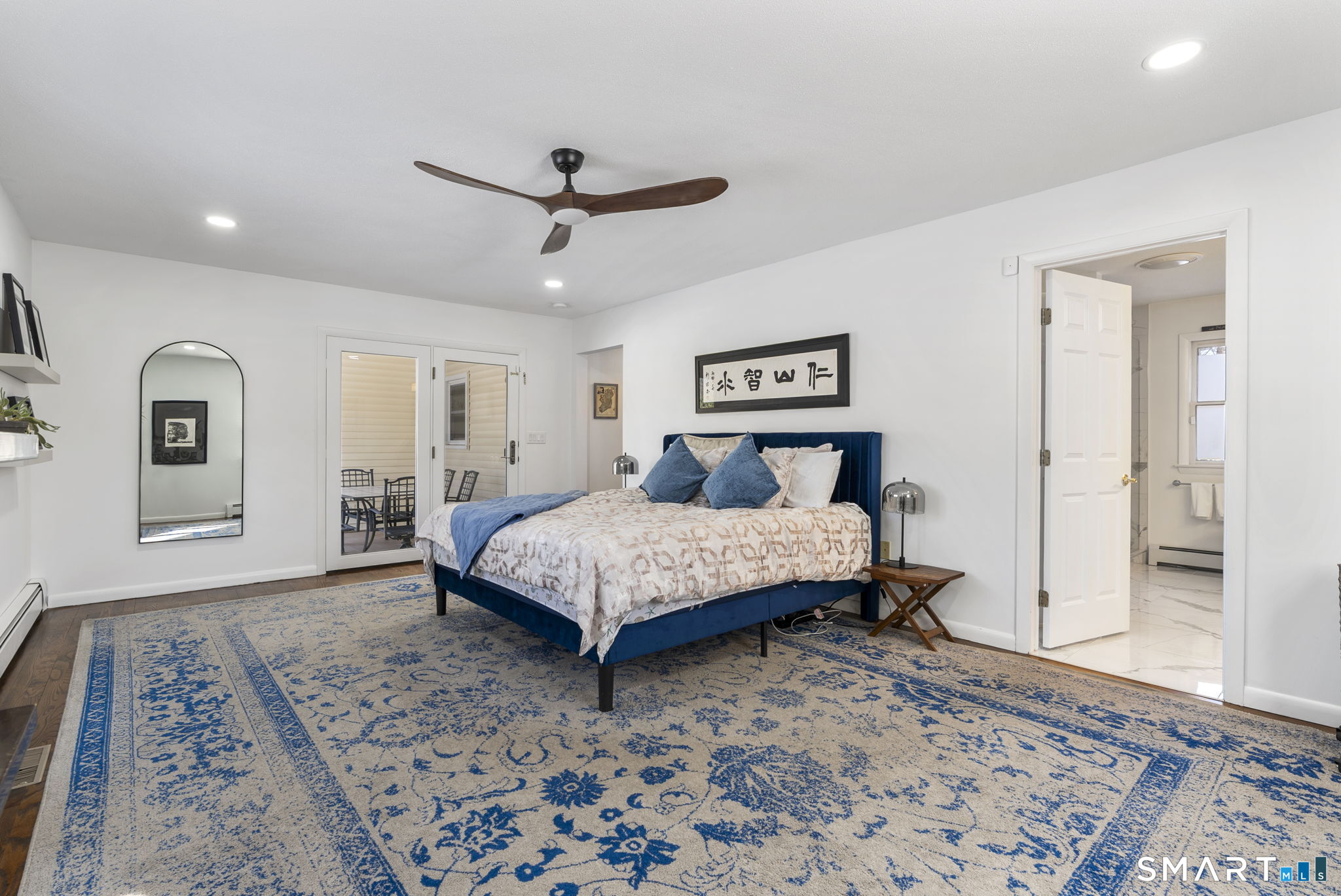 24 Ichabod Road Simsbury, CT 06070 - Photo 16 of 43 a bedroom with a bed and a dresser with wooden floor