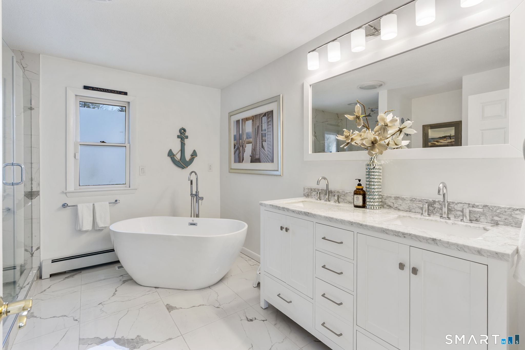 24 Ichabod Road Simsbury, CT 06070 - Photo 17 of 43 a spacious bathroom with a double vanity sink mirror and bathtub