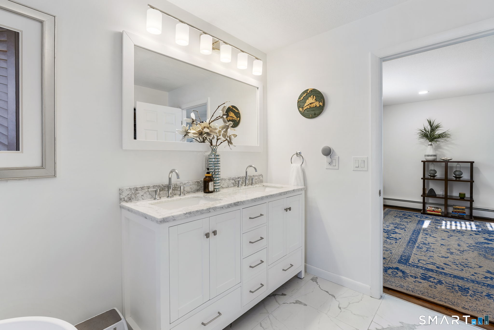 24 Ichabod Road Simsbury, CT 06070 - Photo 19 of 43 a bathroom with double vanity and a mirror