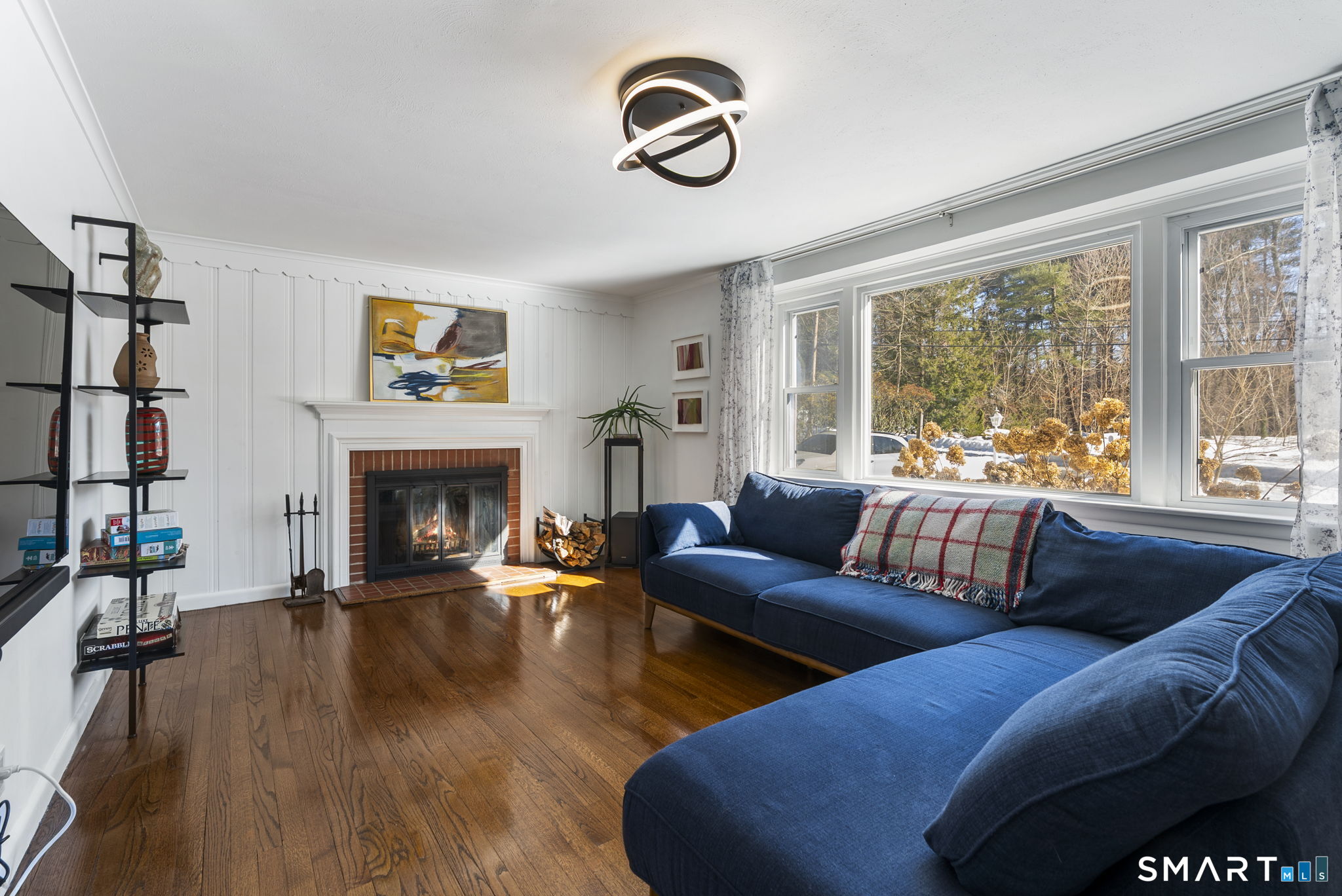 24 Ichabod Road Simsbury, CT 06070 - Photo 21 of 43 a living room with furniture fireplace and a large window