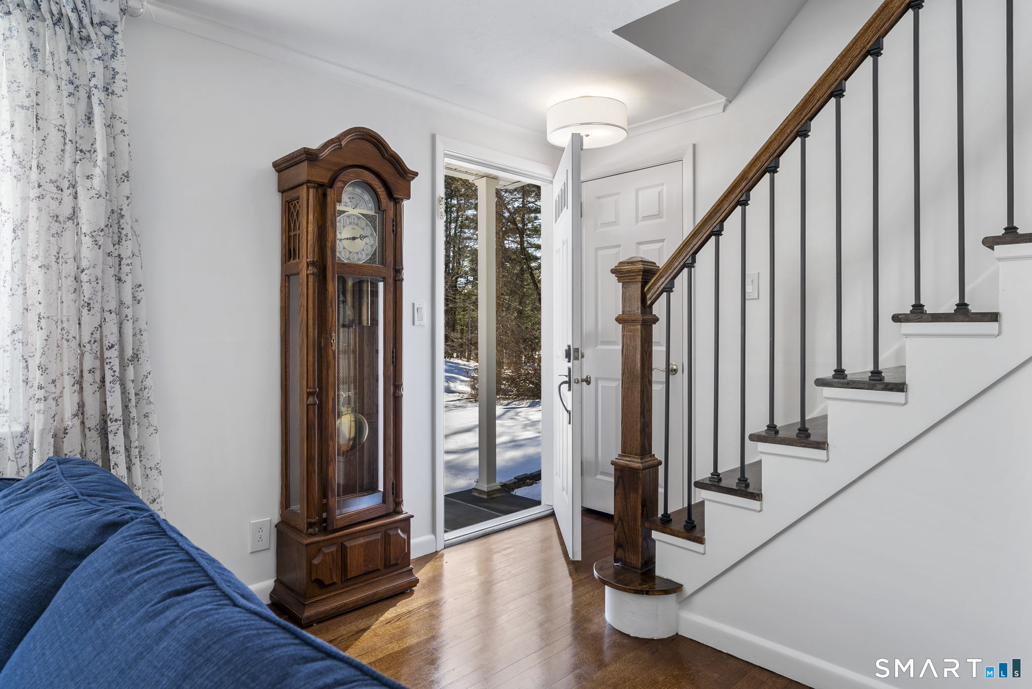24 Ichabod Road Simsbury, CT 06070 - Photo 24 of 43 a view of front door with hallway and wooden floor