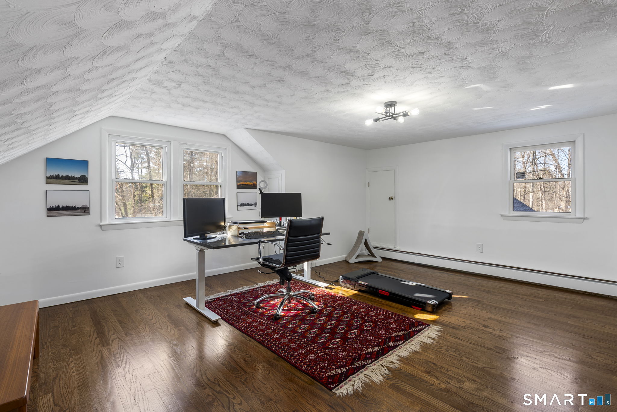24 Ichabod Road Simsbury, CT 06070 - Photo 25 of 43 a living room with furniture and a wooden floor