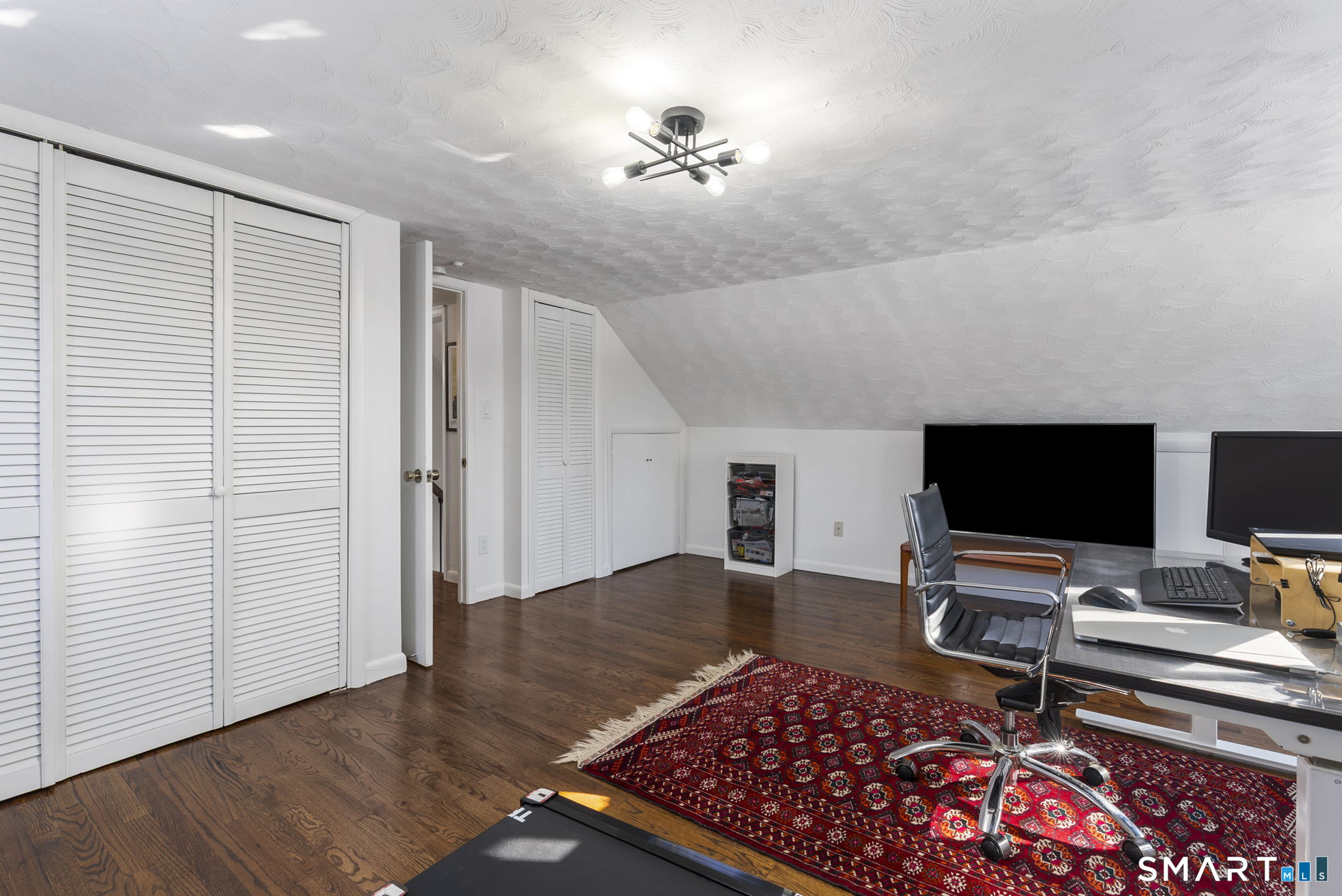 24 Ichabod Road Simsbury, CT 06070 - Photo 26 of 43 a living room with furniture and a flat screen tv