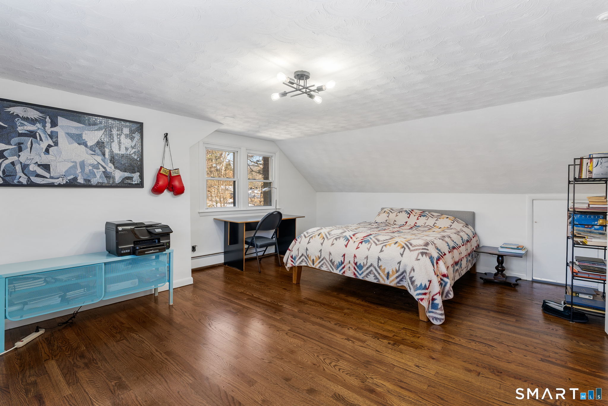 24 Ichabod Road Simsbury, CT 06070 - Photo 30 of 43 a bedroom with a bed and a table in it