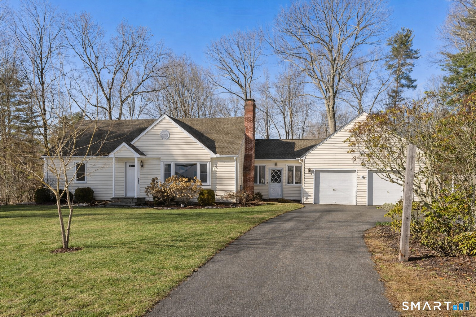 24 Ichabod Road Simsbury, CT 06070 - Photo 3 of 43 a white house that has a tree in front of it