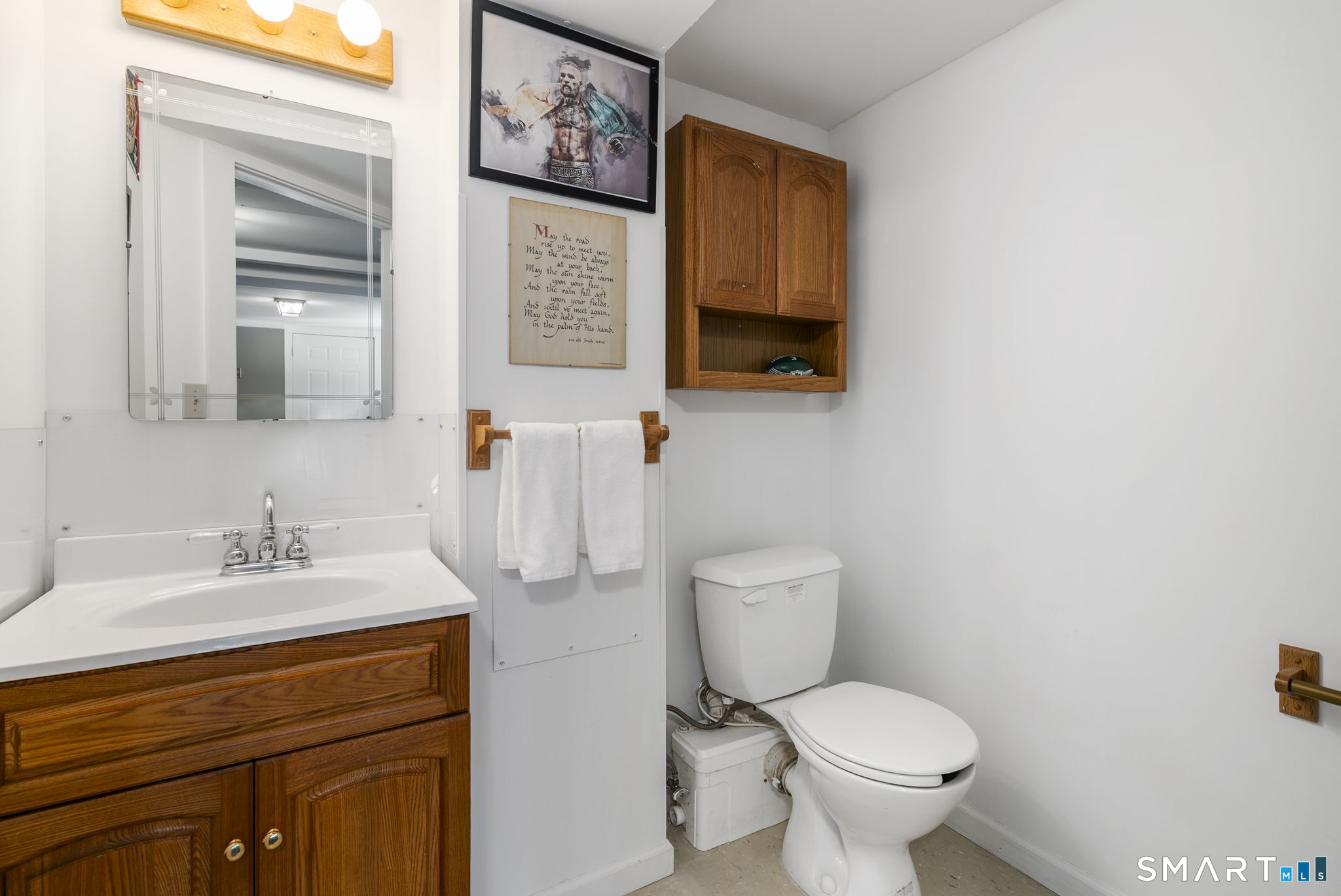 24 Ichabod Road Simsbury, CT 06070 - Photo 33 of 43 a bathroom with a toilet sink and mirror