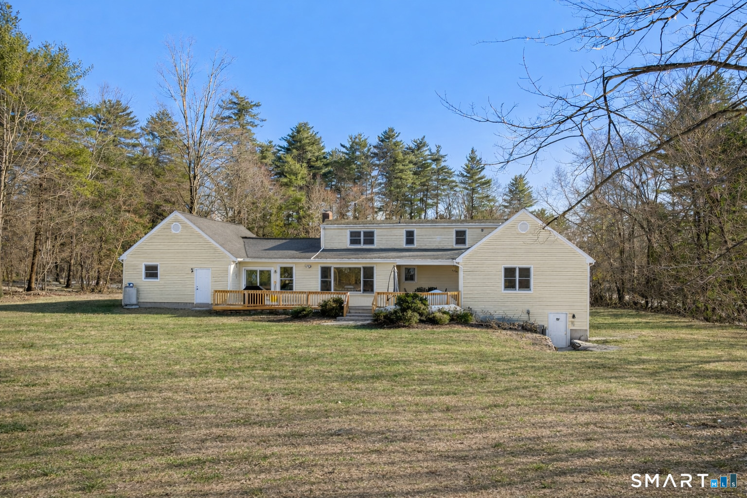 24 Ichabod Road Simsbury, CT 06070 - Photo 38 of 43 a front view of house with yard and trees in the background
