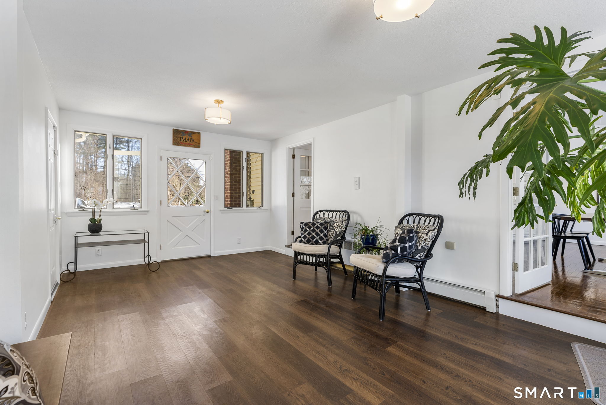 24 Ichabod Road Simsbury, CT 06070 - Photo 4 of 43 a view of a livingroom with furniture and a wooden floor