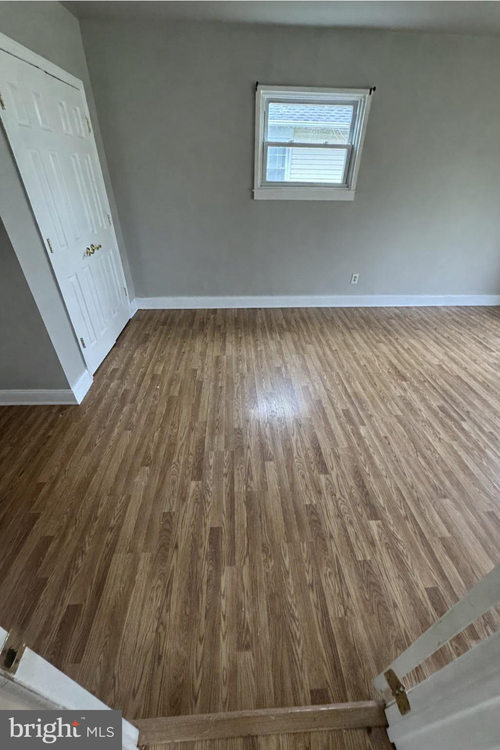 75 Mainbridge Lane Willingboro, NJ 08046 - Photo 7 of 8 a view of an empty room with wooden floor and a window