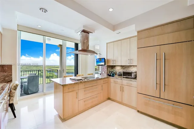 a kitchen with a stove a refrigerator and a sink