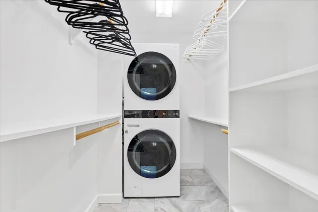 a close view of a utility room with dryer and washer