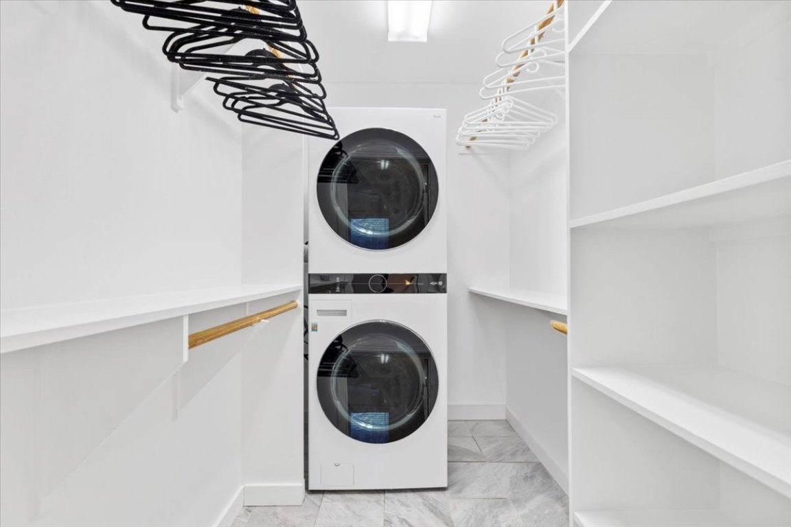 1422 Collier Street, Unit 103 Austin, TX 78704 - Photo 16 of 27 a close view of a utility room with dryer and washer