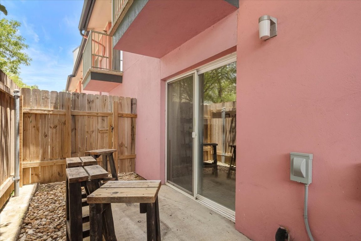 1422 Collier Street, Unit 103 Austin, TX 78704 - Photo 17 of 27 a view of balcony with two chairs and a table