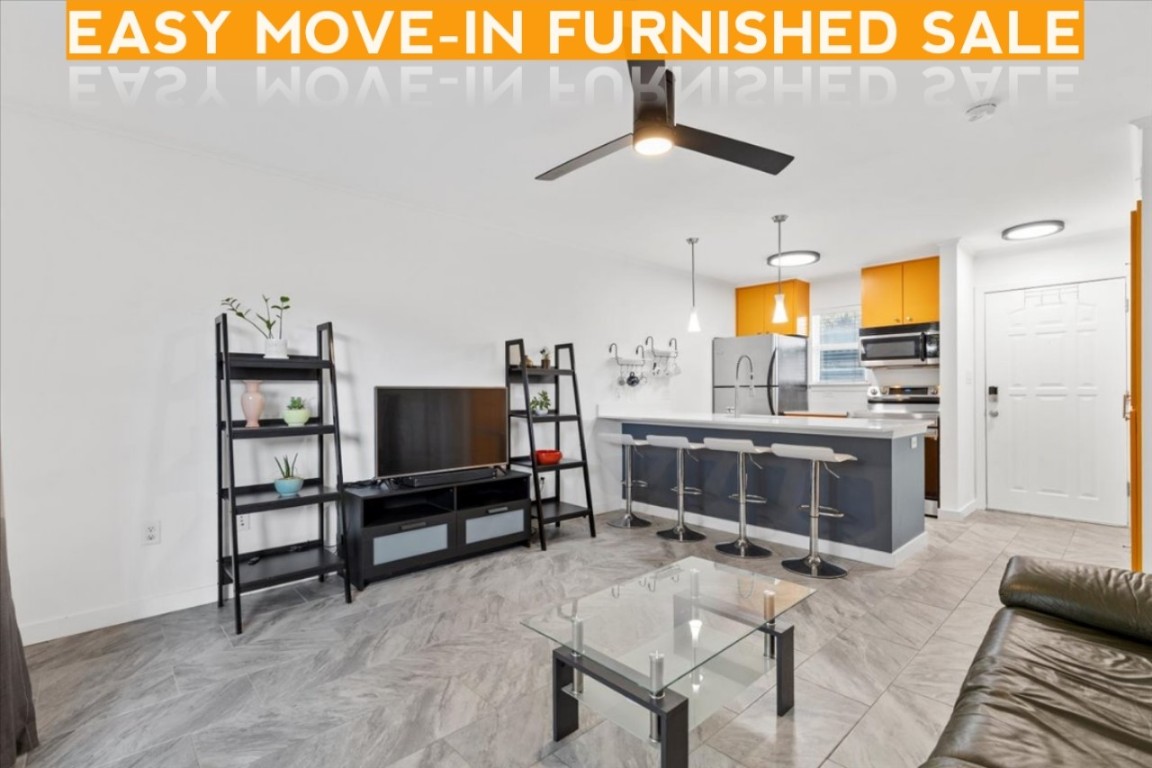 1422 Collier Street, Unit 103 Austin, TX 78704 - Photo 3 of 27 a bedroom with furniture and a window