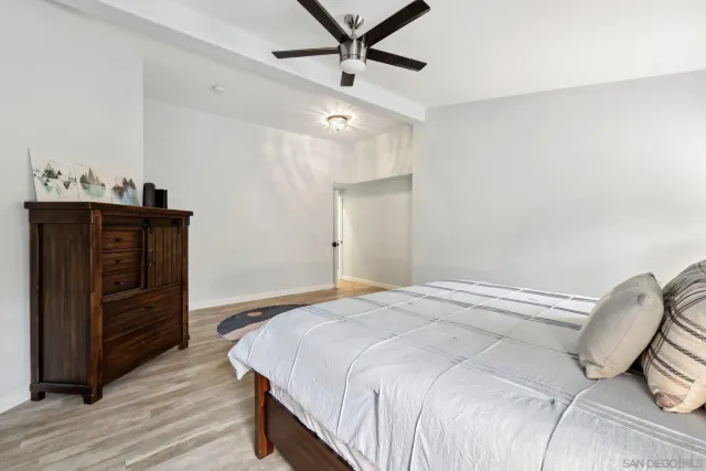 a bedroom with a bed and a dresser