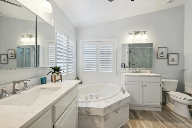 a bath tub sitting in a bathroom next to a window